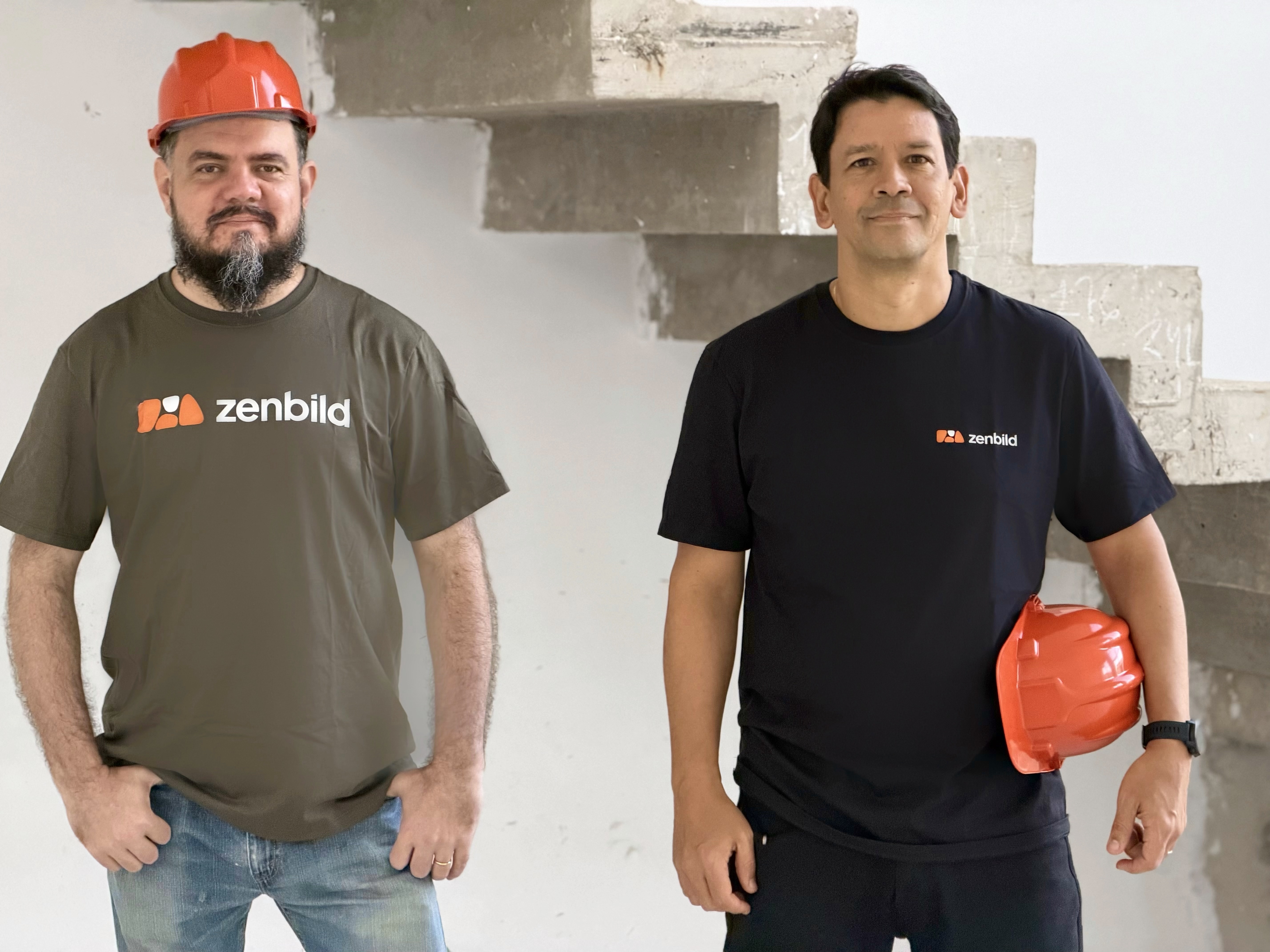 Joaquim Venancio and Bruno Schmidt, co-founders of Zenbild, wearing hard hats on a jobsite